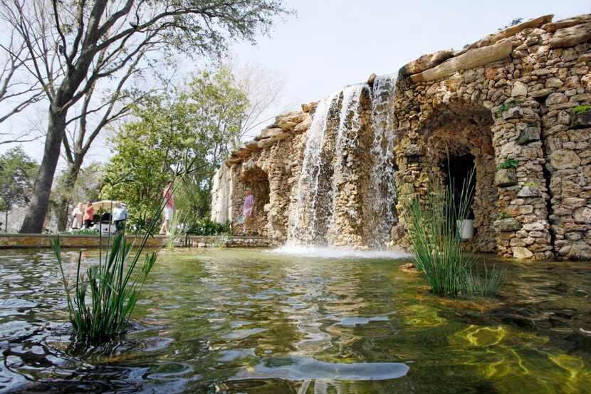 
The new grotto and waterfall in the Lay Family Garden were designed by Dallas landscape...