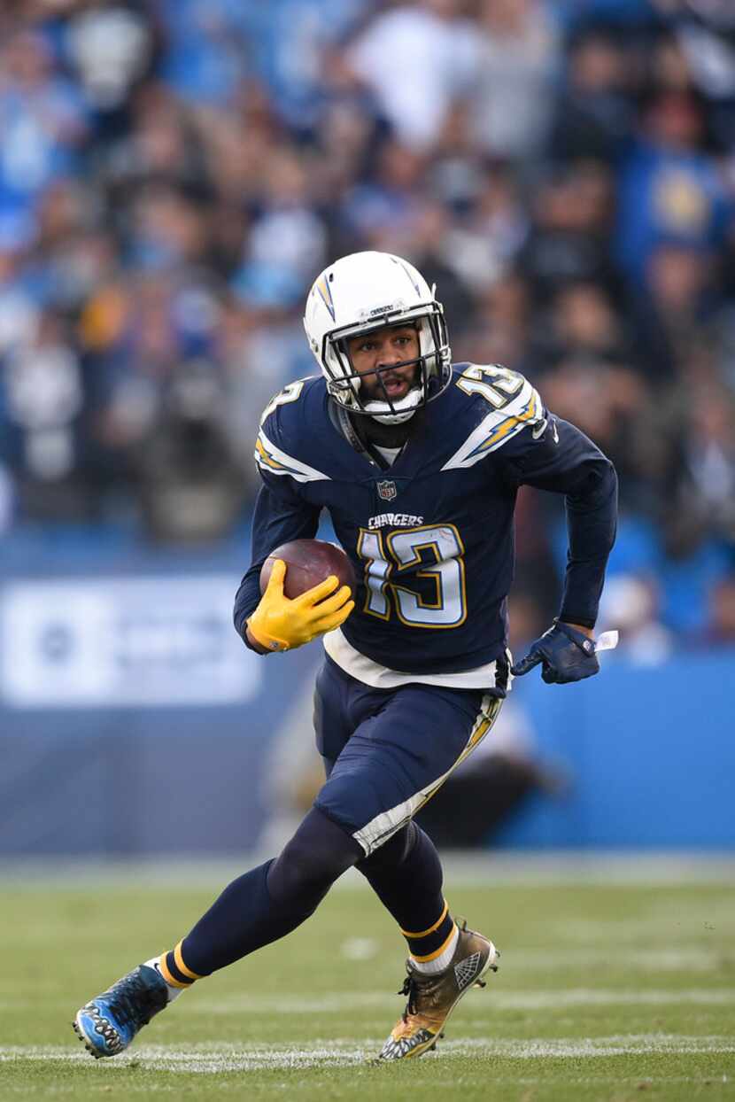 Los Angeles Chargers wide receiver Keenan Allen runs with the ball during the second half of...