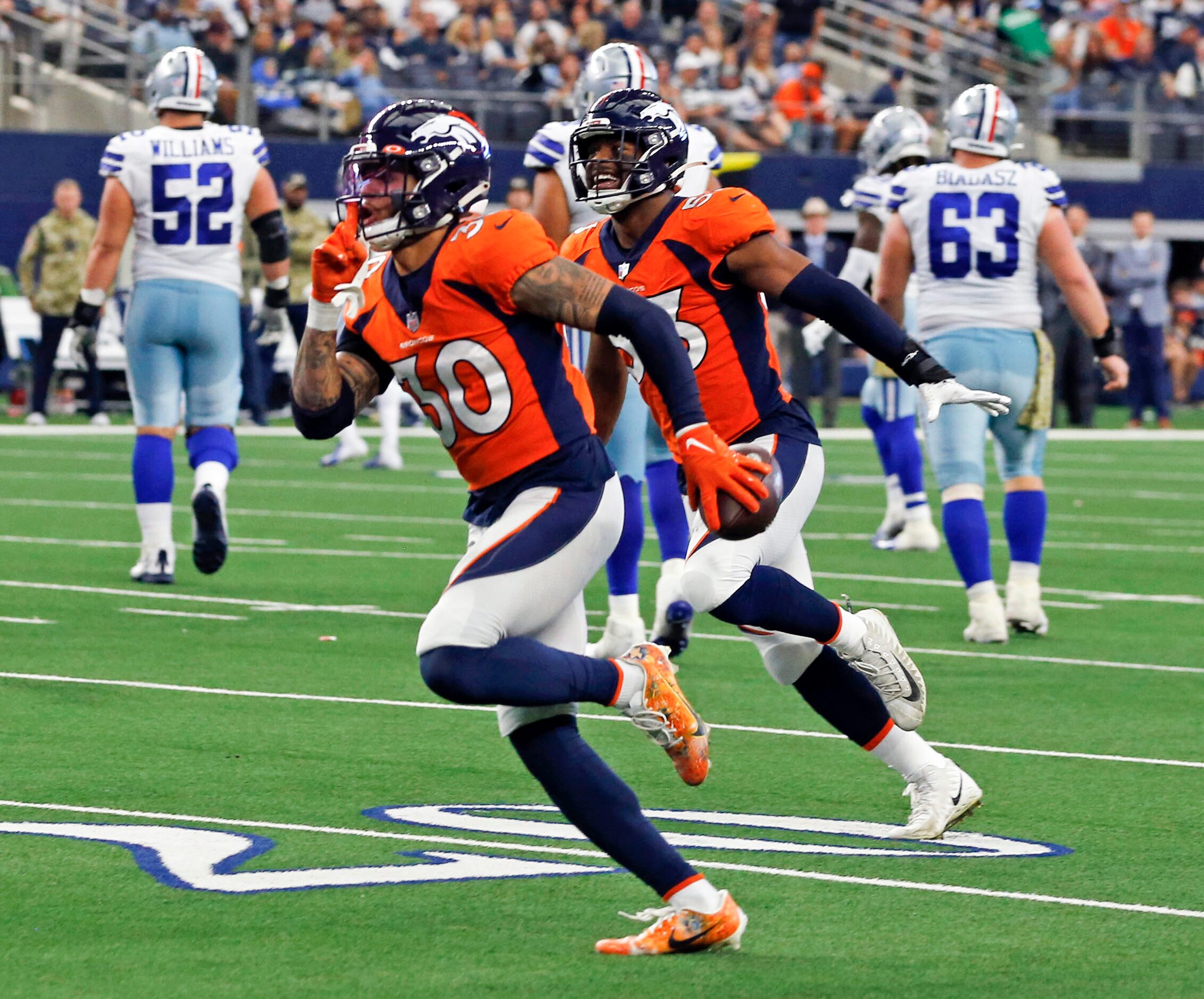 Denver Broncos safety Caden Sterns (30) flashes a “shhhh” sign, after making an interception...