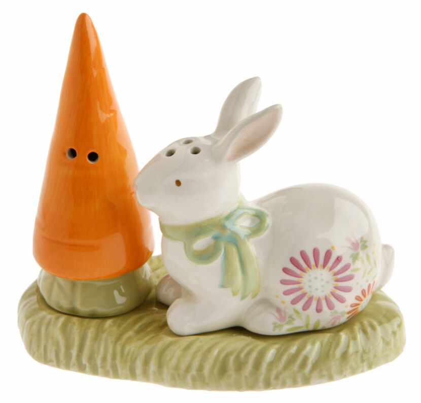 A diminutive 3-inch, ceramic salt and pepper set distribute the spices with a carrot and...