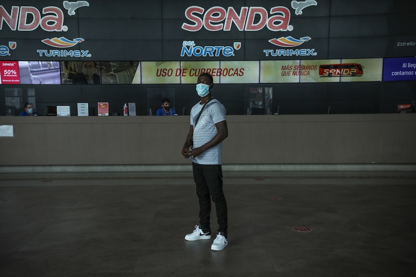 Marckendy Jeanine, 26, poses for a portrait inside the Central Bus Station in Monterrey,...