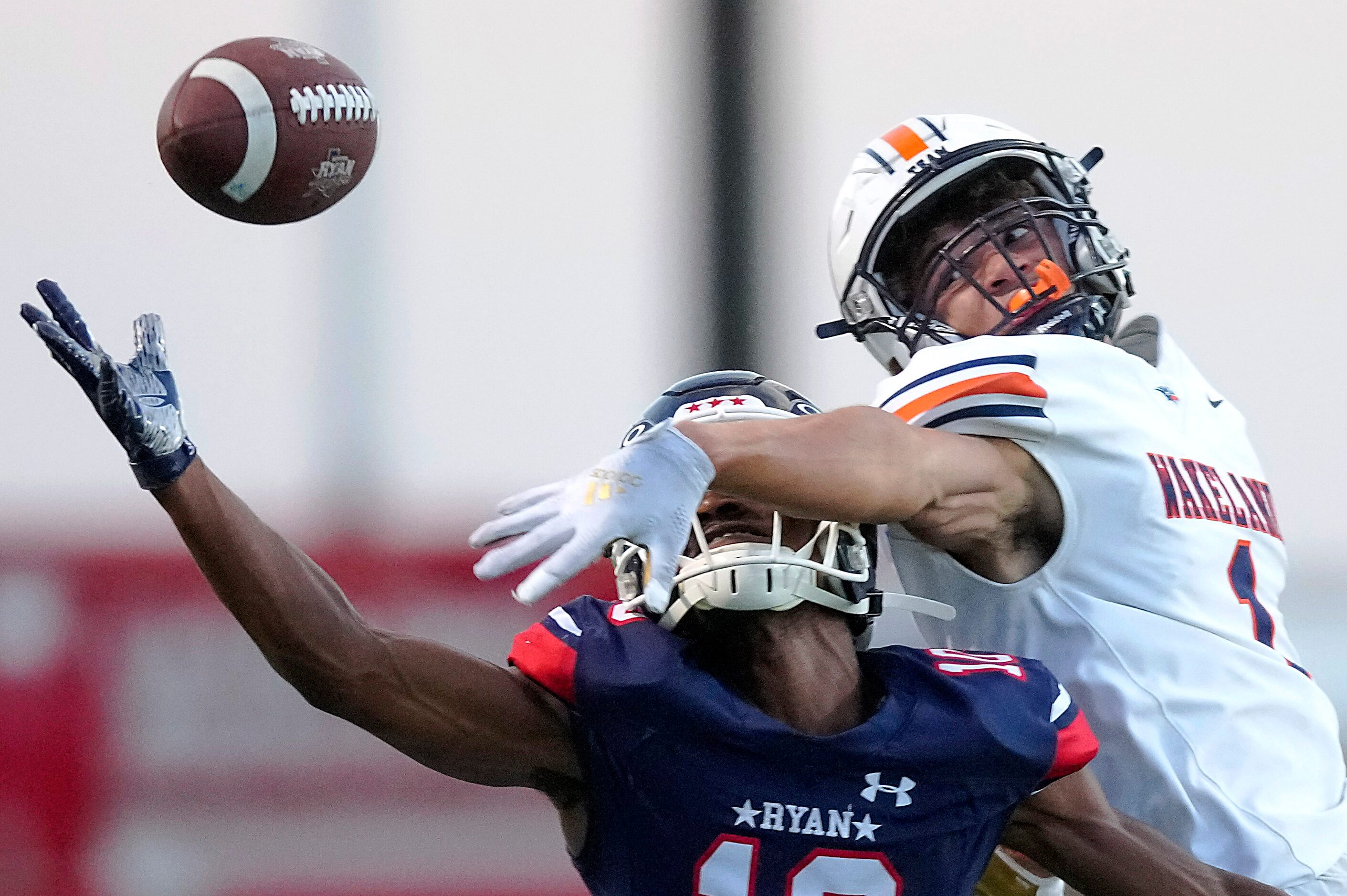 Frisco Wakeland defensive back Davion Woolen (1) breaks up a pass intended for Denton Ryan...