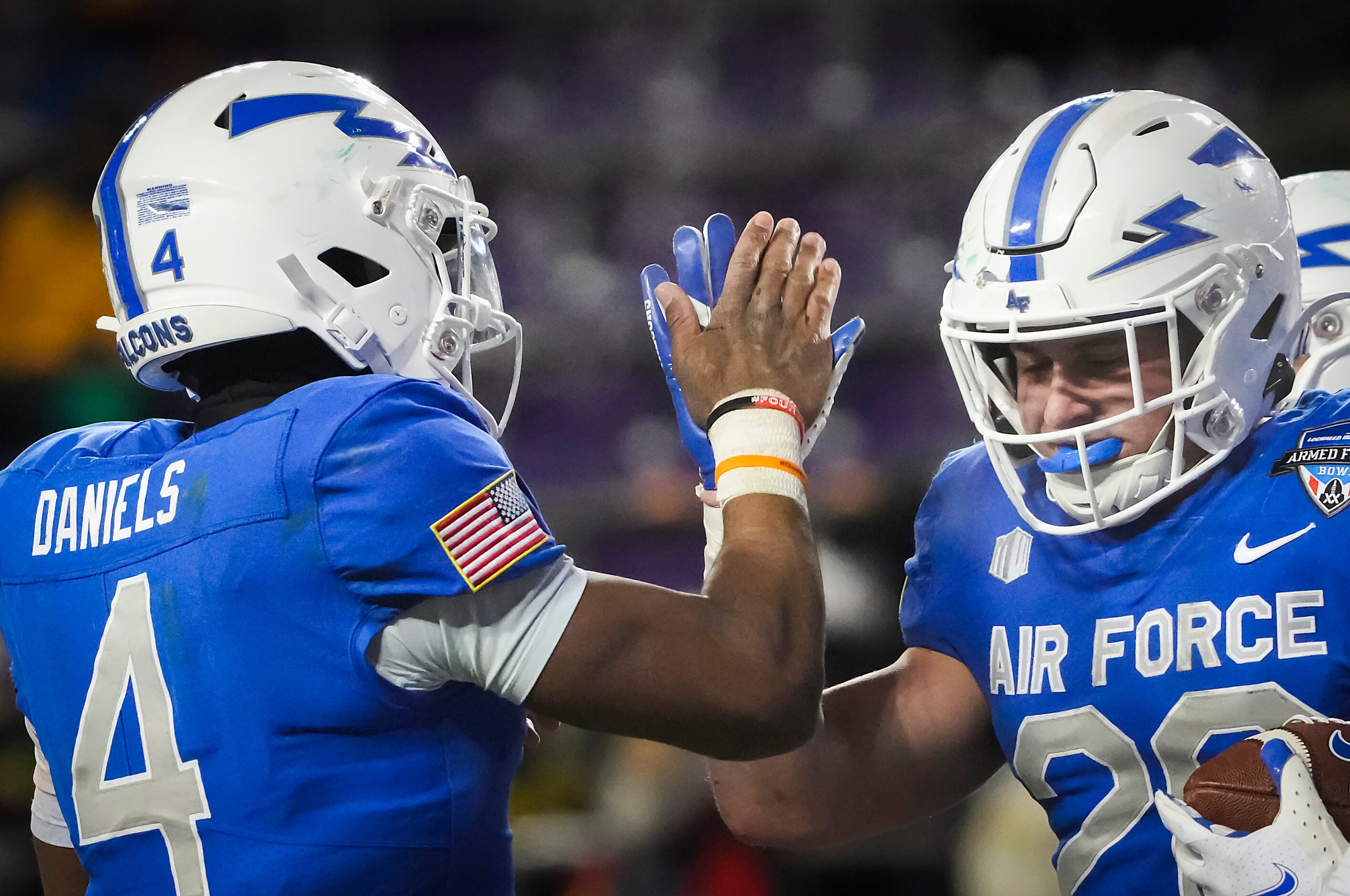 Air Force running back Brad Roberts (20) celebrates a touchdown run with quarterback Haaziq...