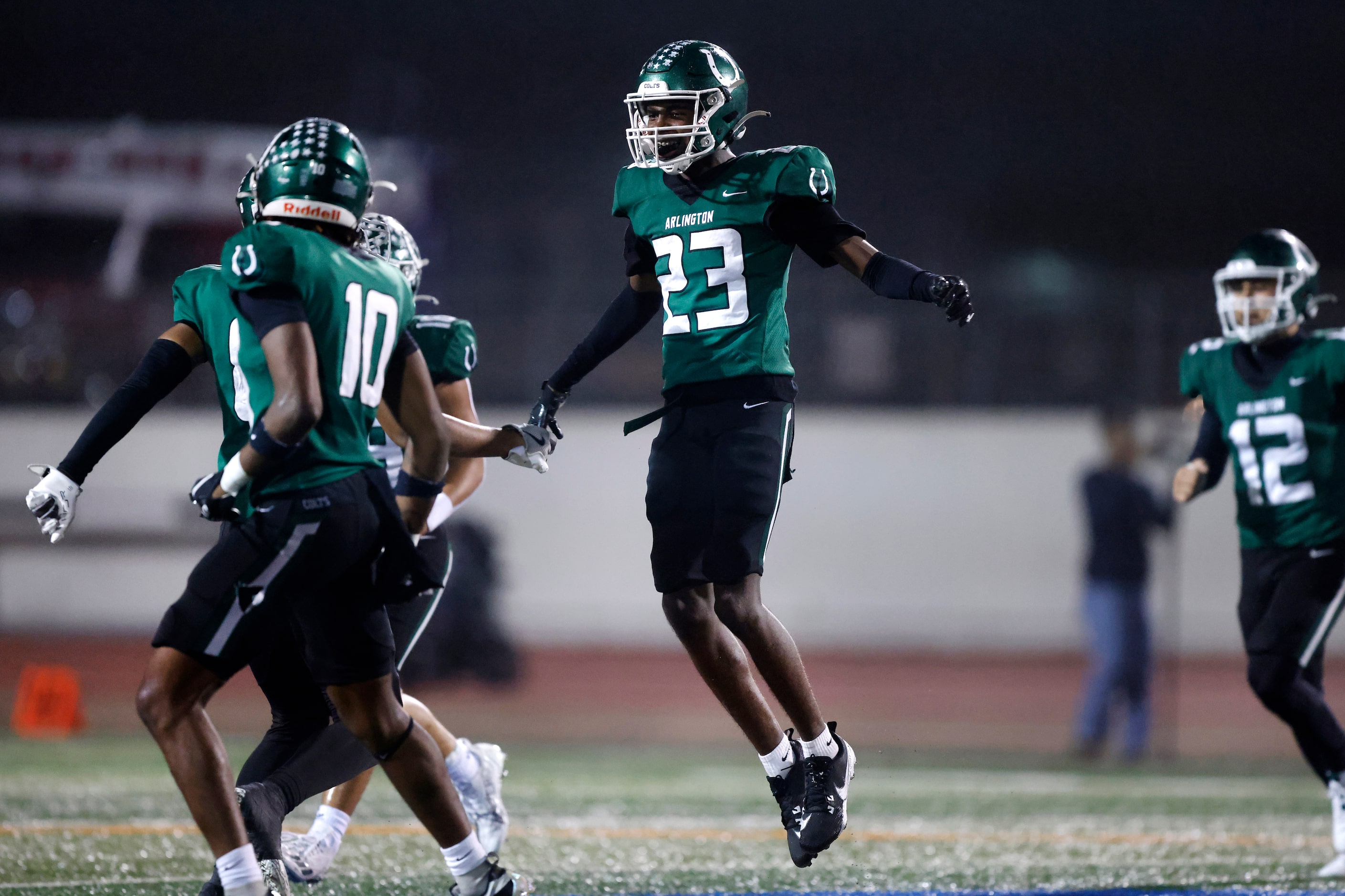 Arlington High defensive back Samajai Davis (23) celebrates his second half turnover of...