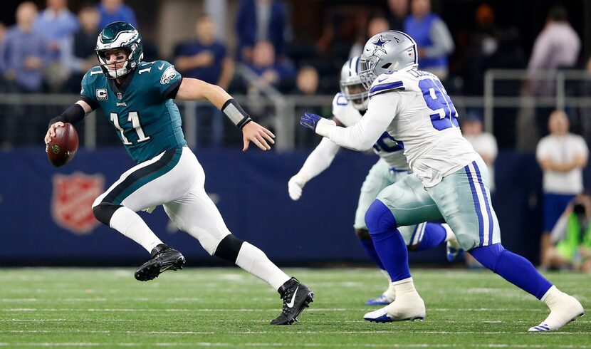 Philadelphia Eagles quarterback Carson Wentz (11) breaks away from Dallas Cowboys defensive...