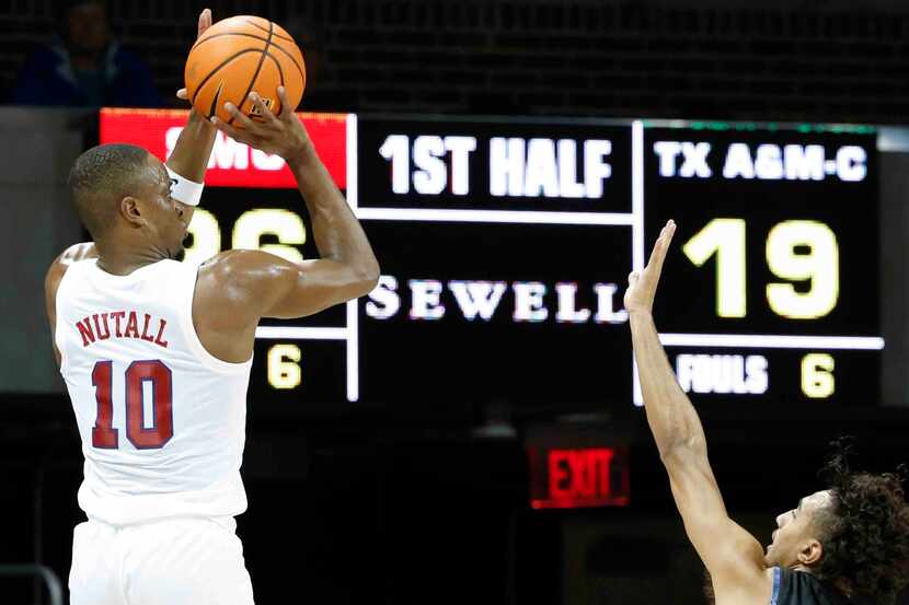 Southern Methodist guard Zach Nutall (10) attempts for a three-pointer as Texas A&M-Comm’s...
