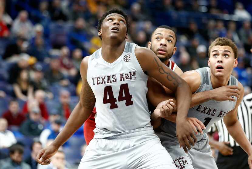 ST LOUIS, MO - MARCH 08:  Robert Williams #44 of the Texas A&M Aggies boxes out for a...