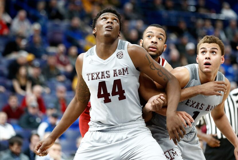 ST LOUIS, MO - MARCH 08:  Robert Williams #44 of the Texas A&M Aggies boxes out for a...