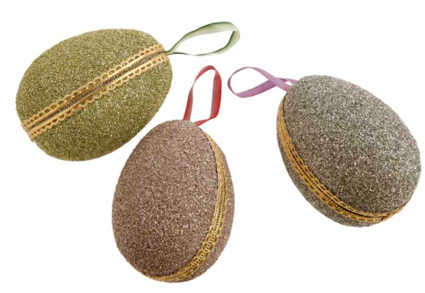 Hinged 4-inch egg ornaments open to hide trinkets inside. $14 each at St. Michael’s Woman’s...