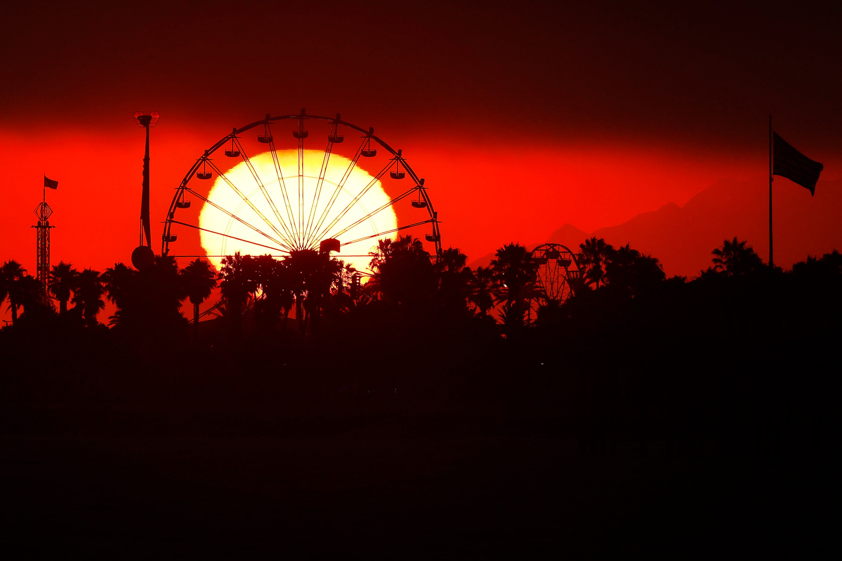 The setting sun drops through a marine layer of air, settling behind the Ventura County Fair...