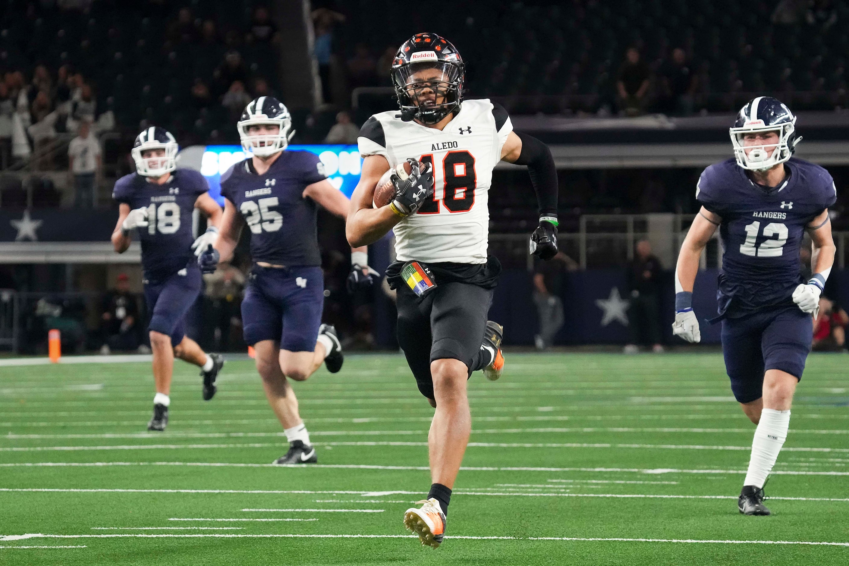 Aledo wide receiver Kaydon Finley races past Comal Smithson Valley’s Cade Spradling (18),...