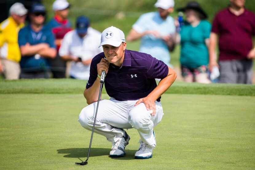 Jordan Spieth lines up a putt on the first green during the first round of the Byron Nelson...