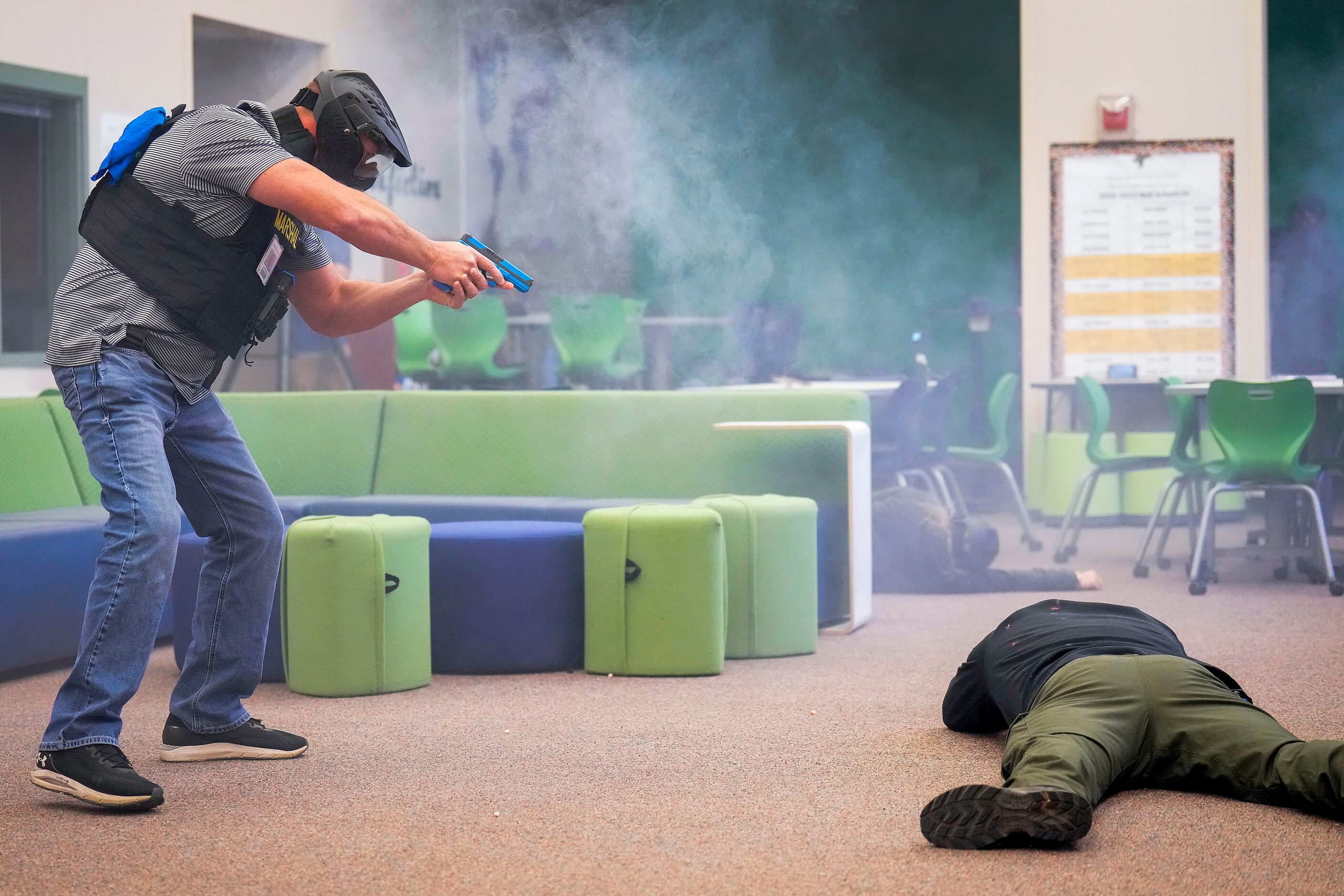 A school marshal participates in an active shooter during in a school safety active shooter...