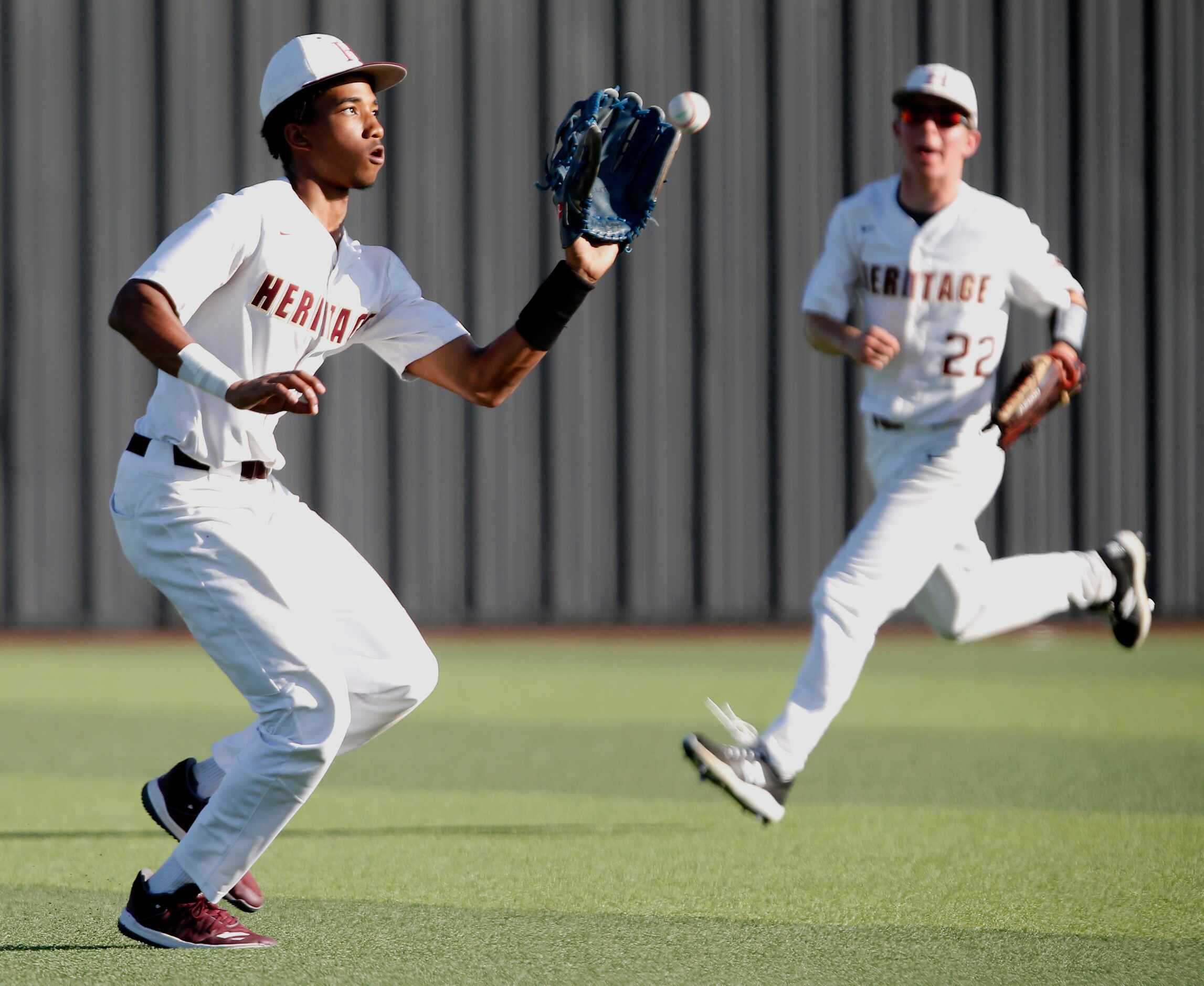 Heritage left fielder Kelly Yancy (4) makes the catch for an out to retire the side as Tyler...