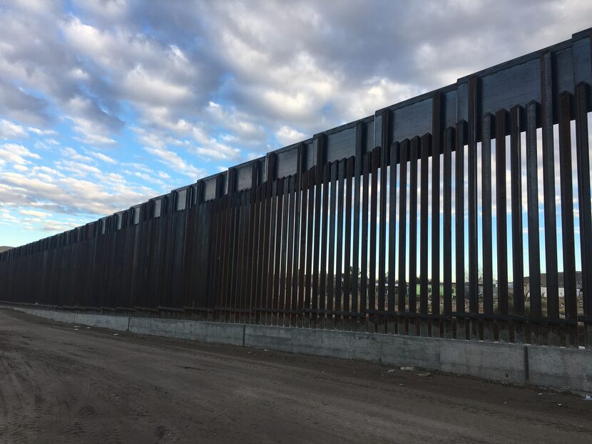 The current border fence extends along a stretch of border in the desert near El Paso.