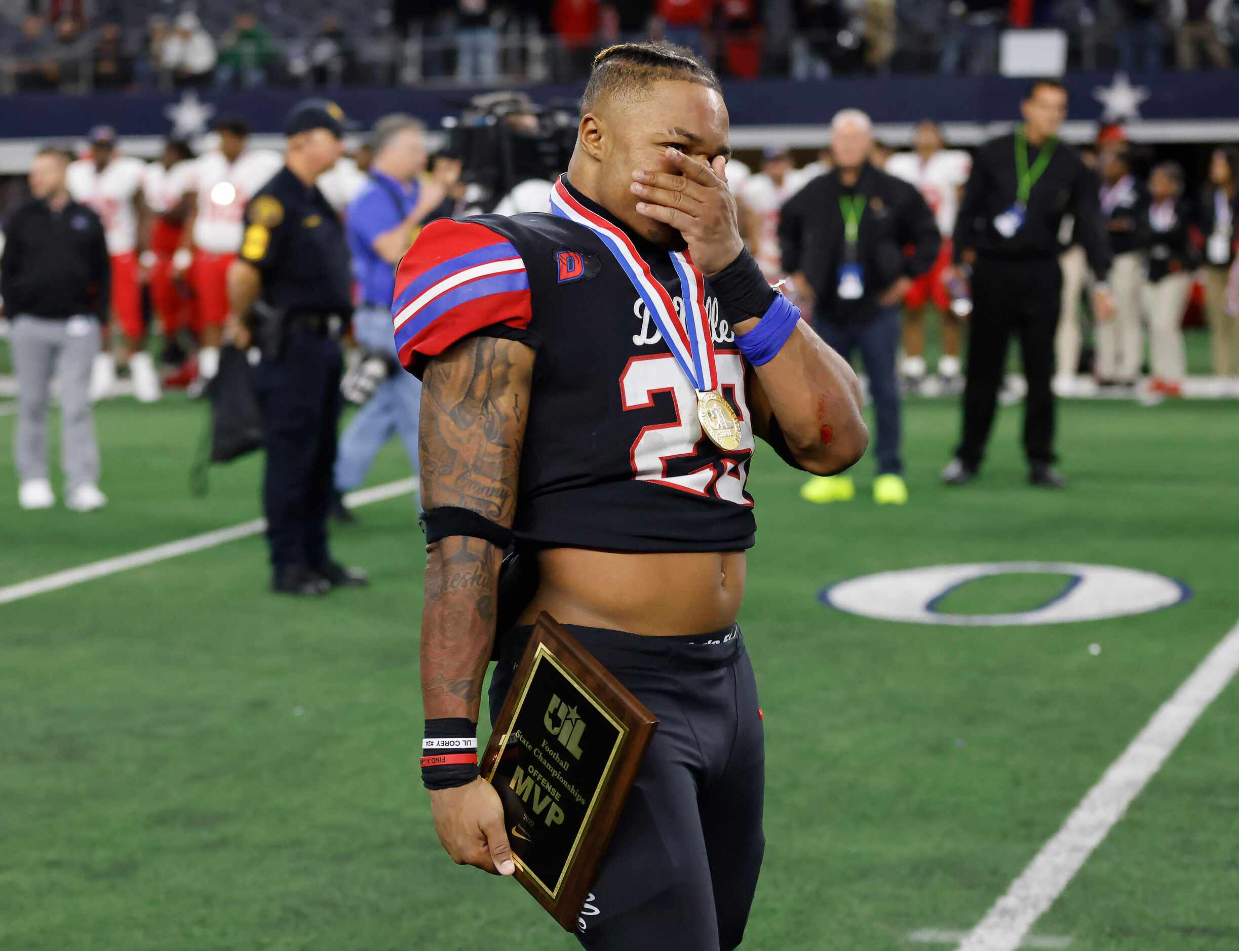 Duncanville’s Caden Durham (29) is overcome with emotion after being named the most valuable...