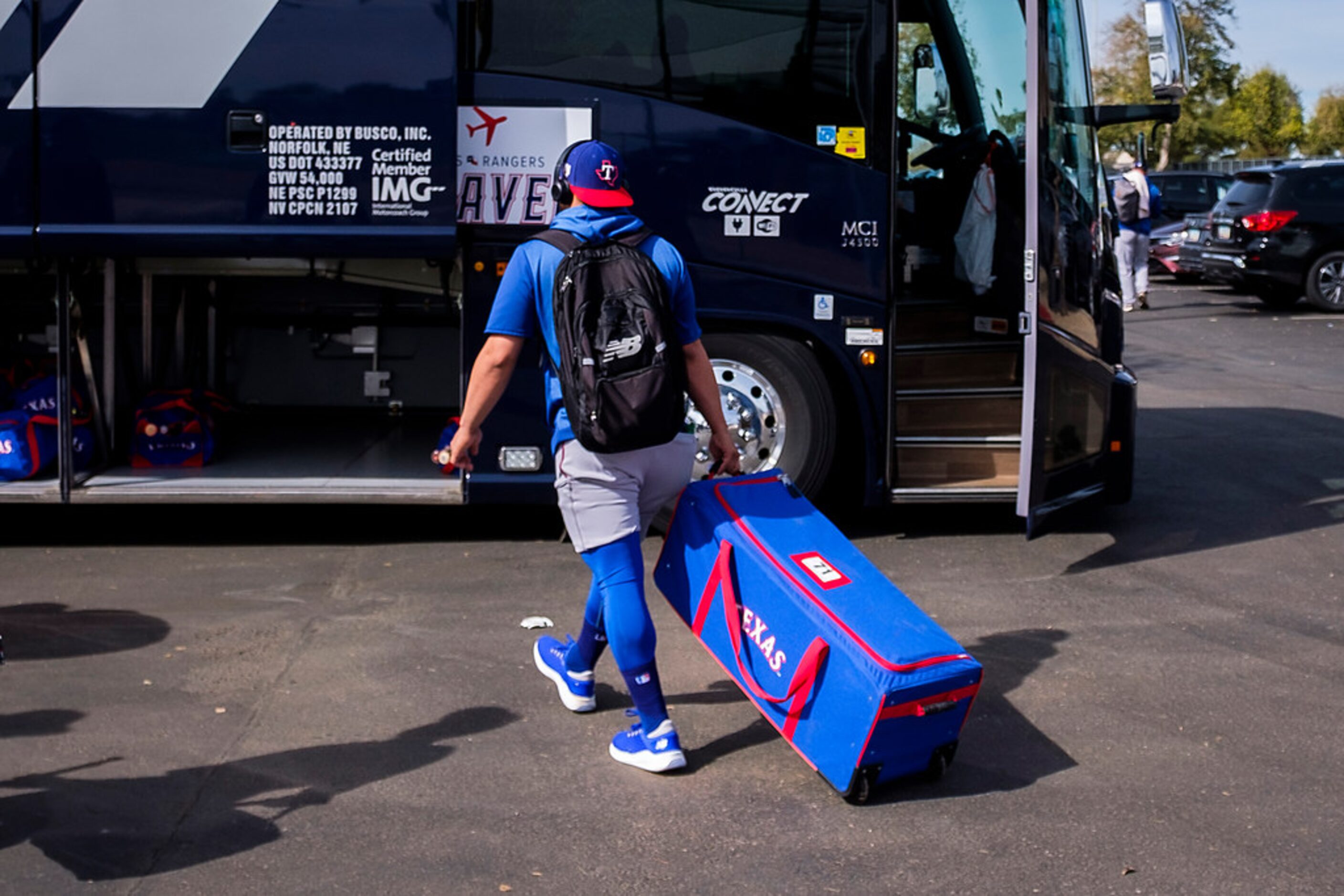 Texas Rangers catcher Jose Trevino heads for the team bus for a road trip to face the...