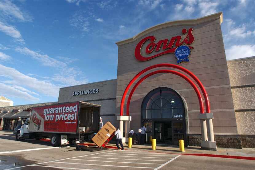 11-18-2003 - Appliances are unloaded a Conn's Electronics  store at 2422 South Stemmons...