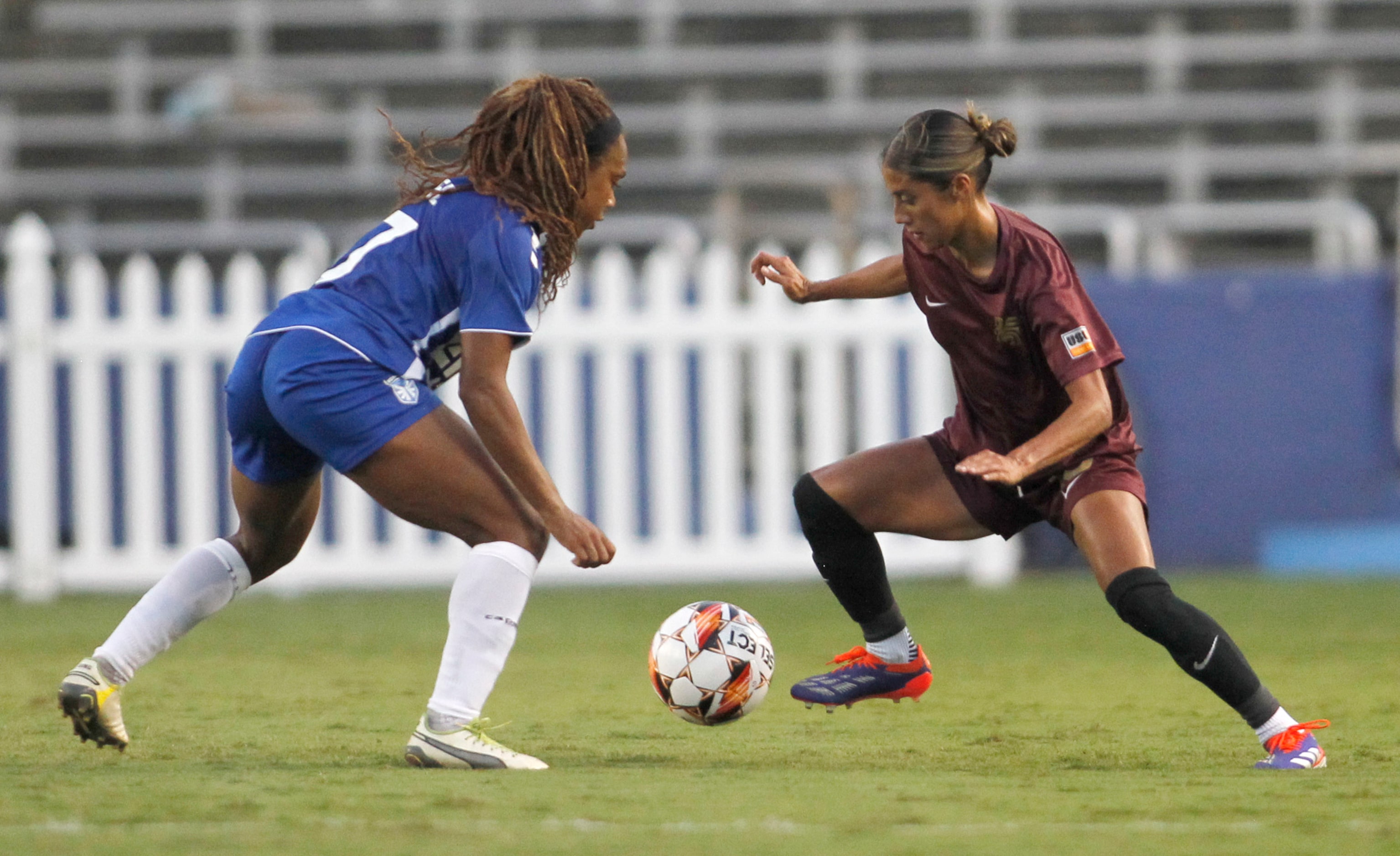 Dallas Trinity FC's Samantha Meza (15), right, works to maneuver around the defense of DC...