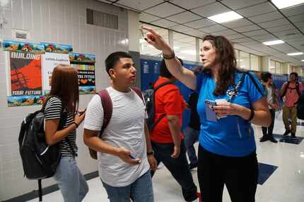 Freshman Bryan Sandoval gets directions to class from Campus Life Coordinator Jalah Grey on...