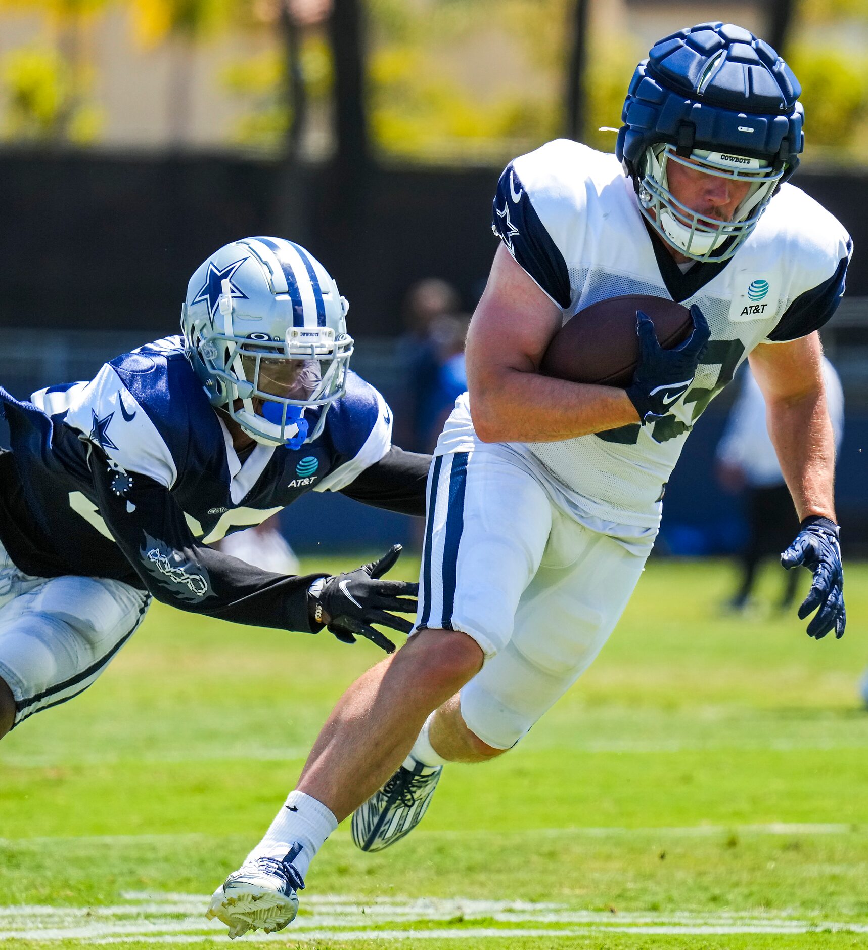 Dallas Cowboys running back Hunter Luepke (43) gets past defensive back Sheldrick Redwine...