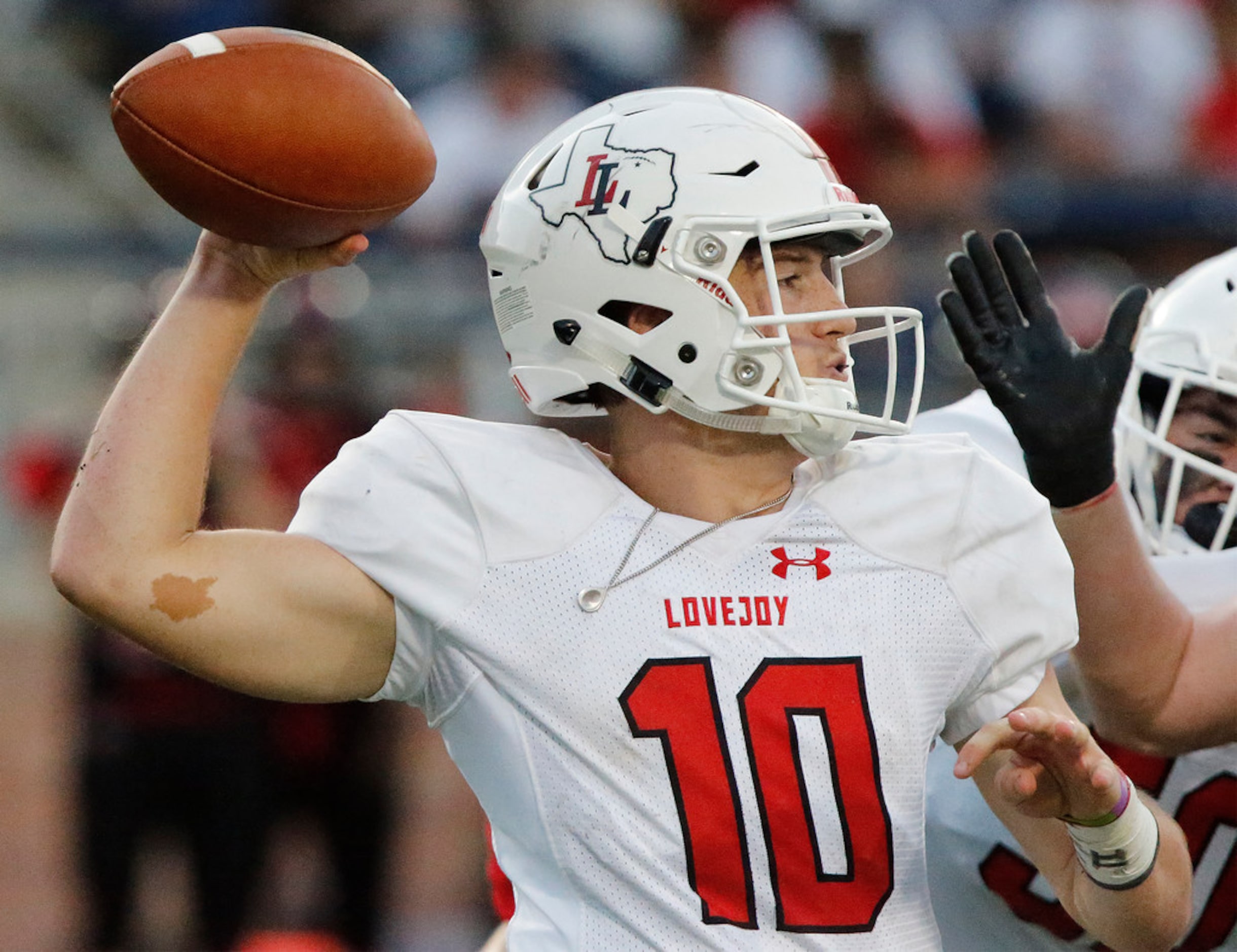 Lovejoy High School quarterback Ralph Rucker (10) throws a pass during the first half as...