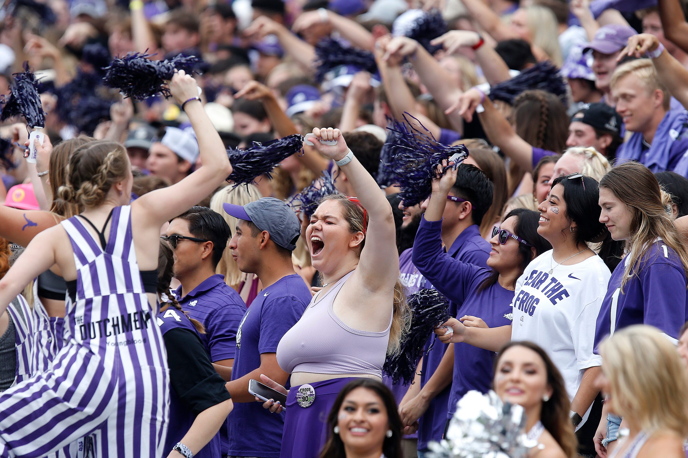 The TCU student section celebrates a touchdown during the first half as the TCU Horned Frogs...