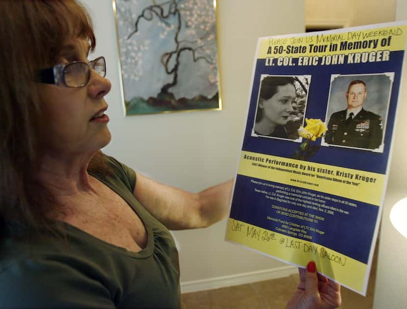 Carol Kruger, mother of Eric and Kristy Kruger, examines a tour flyer about her daughter,...