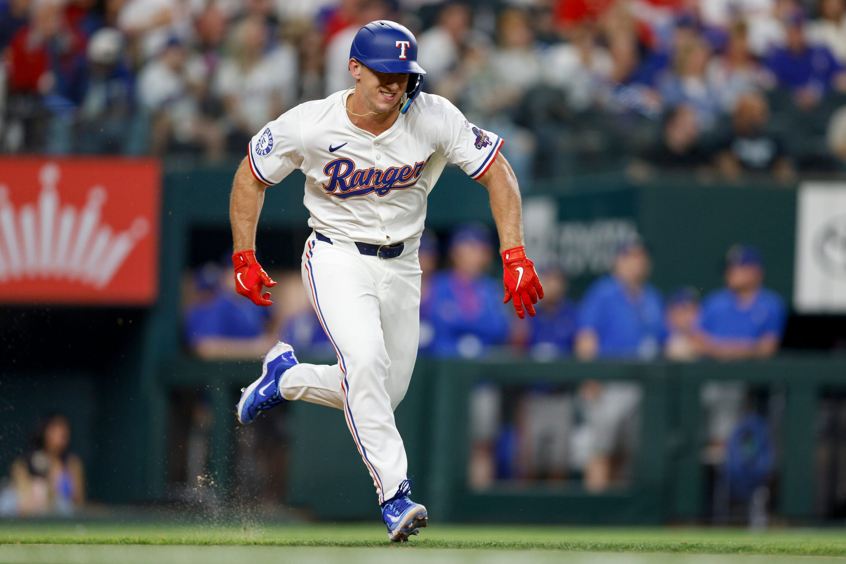 Texas Rangers designated hitter Wyatt Langford (36) races down the first base line for his...