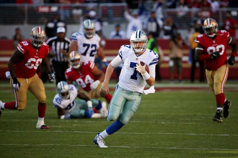 Dallas Cowboys quarterback Cooper Rush (7) rushes with the ball in the fourth quarter during...