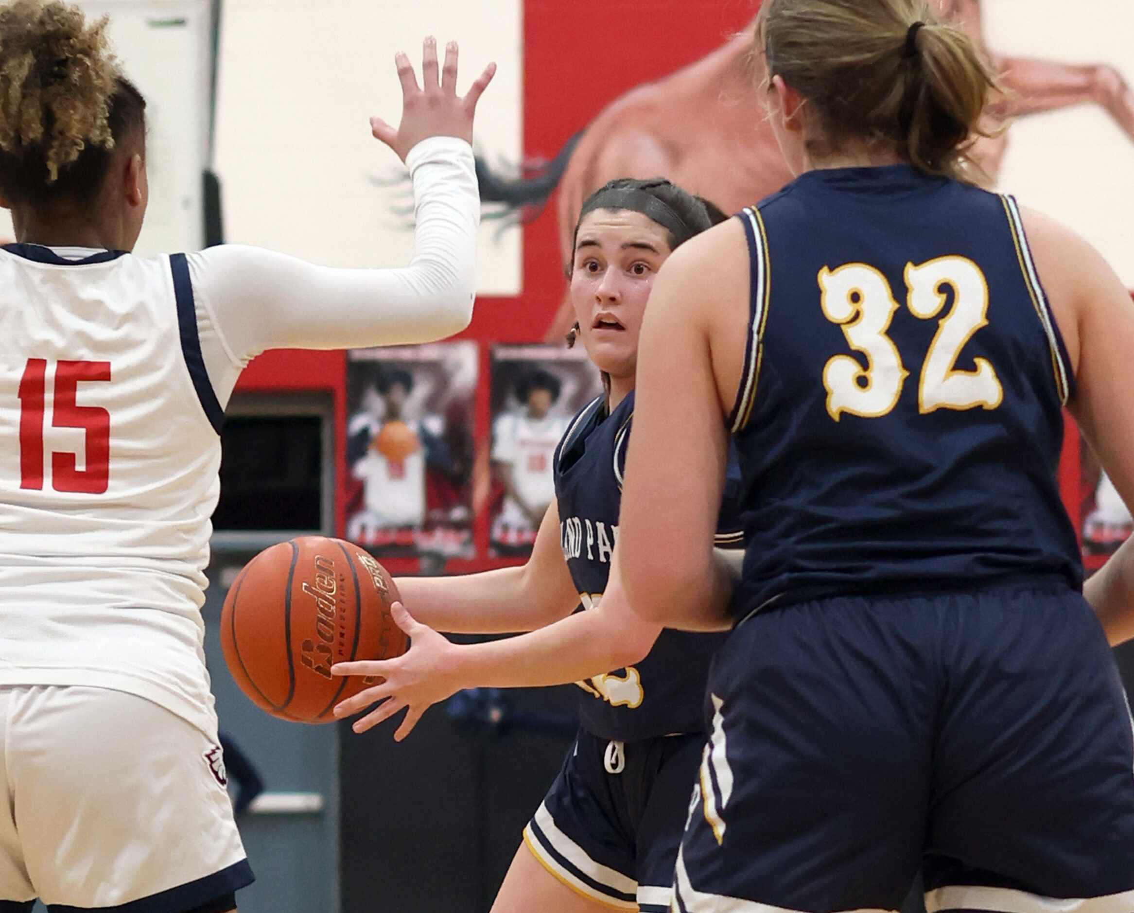 Highland Park guard Audrey Walker (22) looks to pass during second half action against...