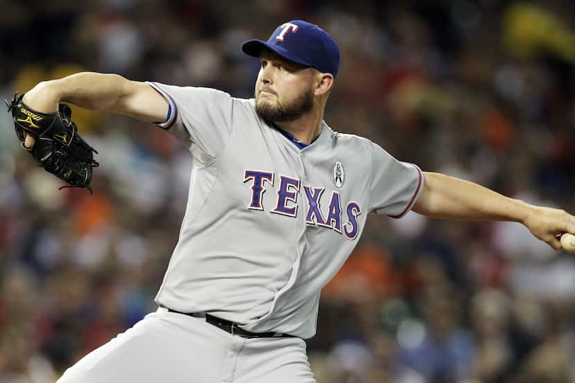 HOUSTON, TX - MARCH 31:  Matt Harrison #54 of the Texas Rangers throws against the Houston...