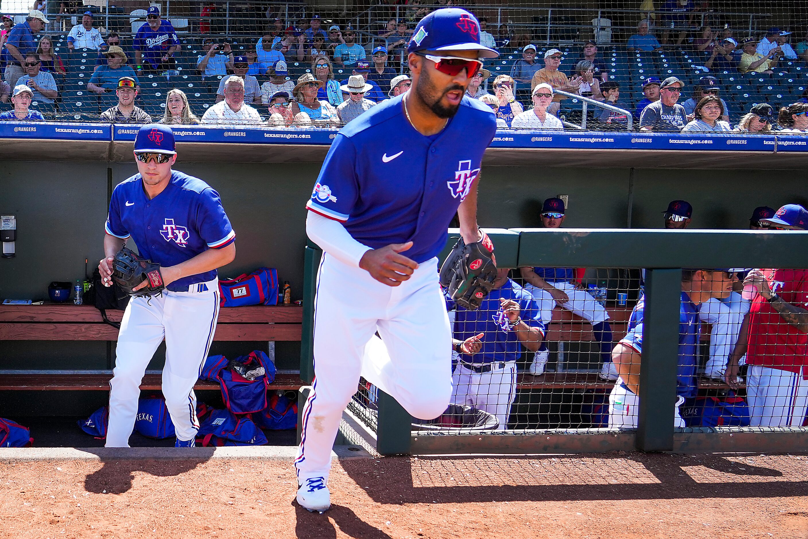 Texas Rangers second baseman Marcus Semien (right) and shortstop Corey Seager take the field...