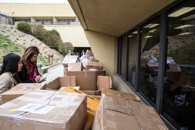 Stacked shipments of H-1B visa petitions outside a government processing center in Laguna...