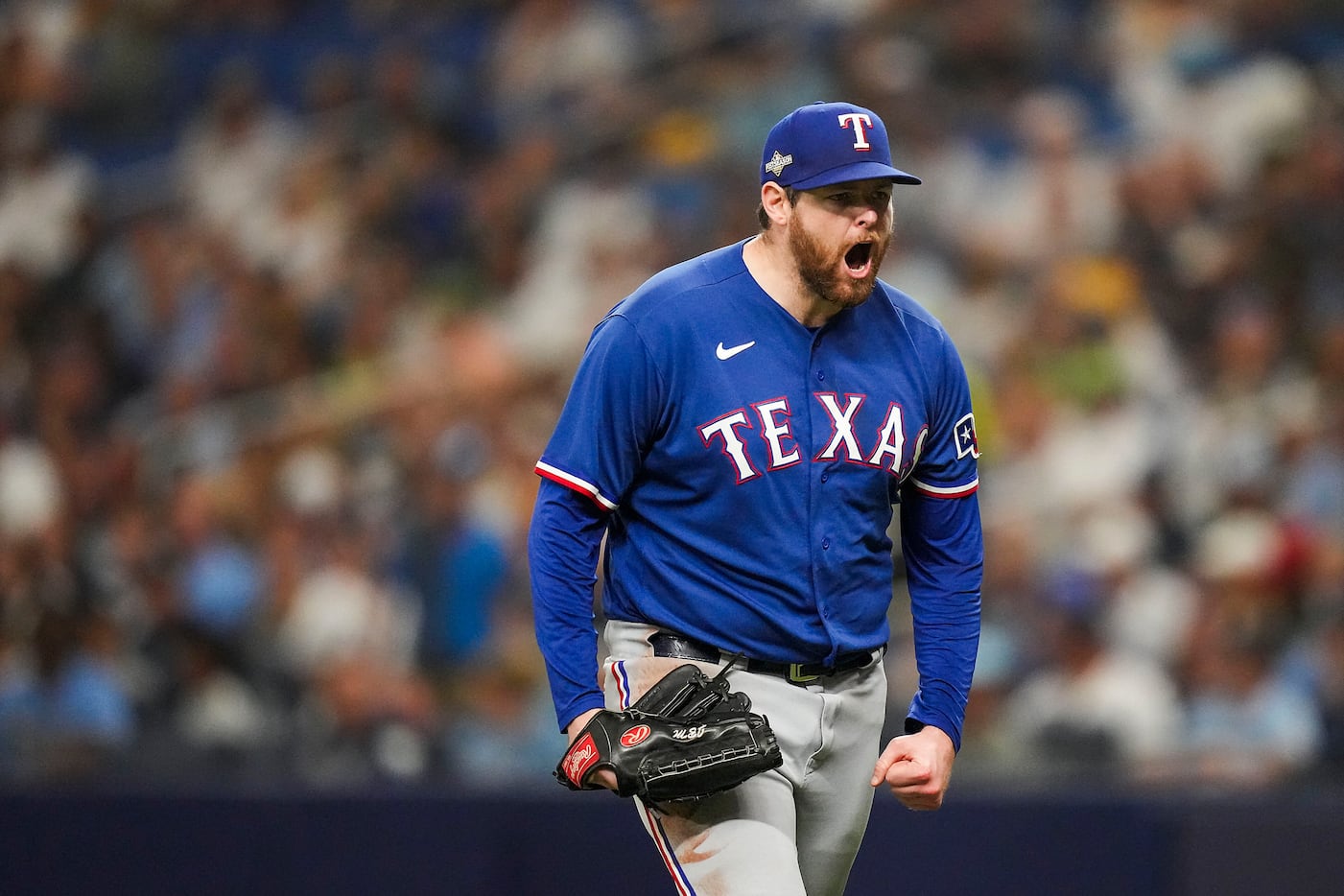 Texas Rangers starting pitcher Jordan Montgomery reacts after striking out Tampa Bay Rays...