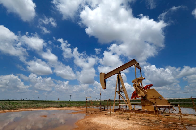 A pump jack draws oil north of Lubbock, Texas, Wednesday, August 2, 2017. (Tom Fox/The...