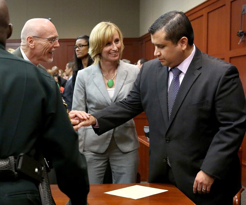 George Zimmerman is congratulated by his defense team after being found not guilty, on the...