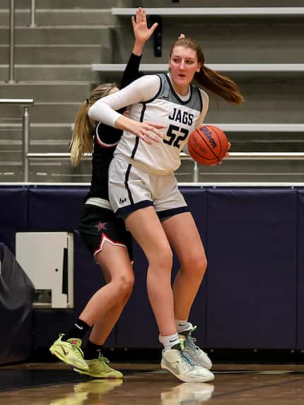 Flower Mound center Abbie Boutilier (52) with the ball  against Coppell during the first...