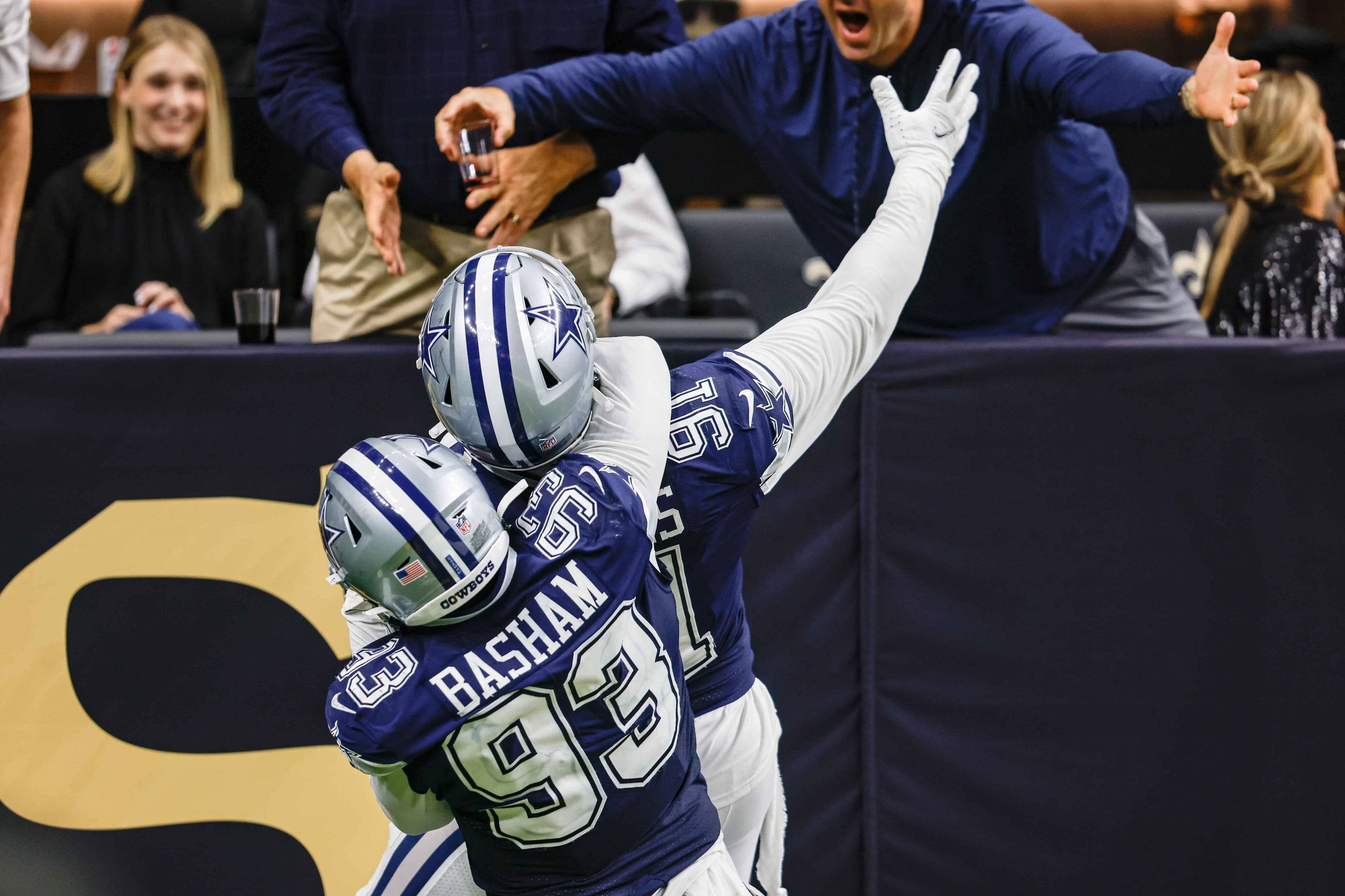 Dallas Cowboys defensive tackle Carlos Watkins (91) celebrates an interception with Tarell...