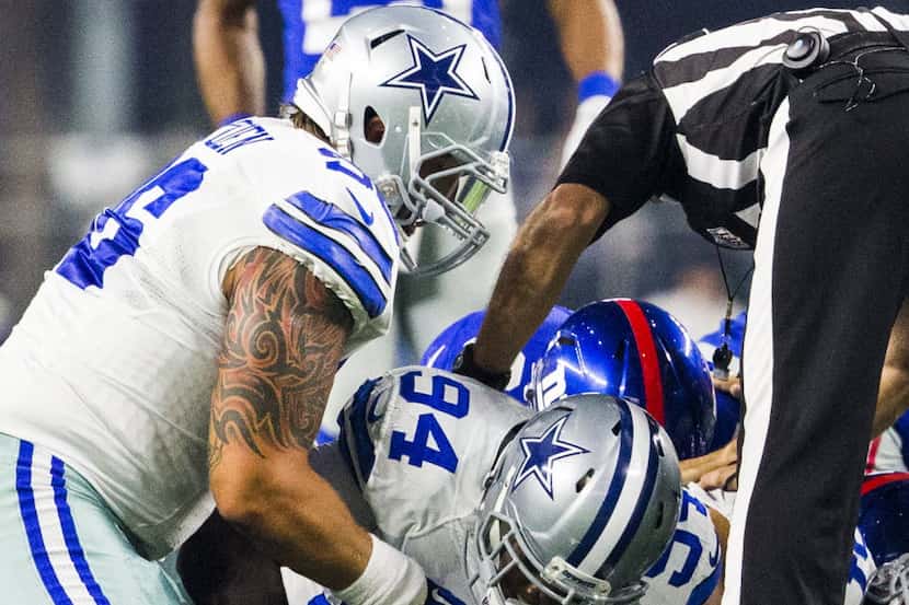 Dallas Cowboys defensive end Randy Gregory (94) recovers a fumble from the New York Giants...