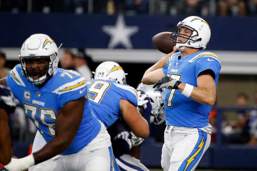 Los Angeles Chargers offensive tackle Russell Okung (76) guards as quarterback Philip Rivers...