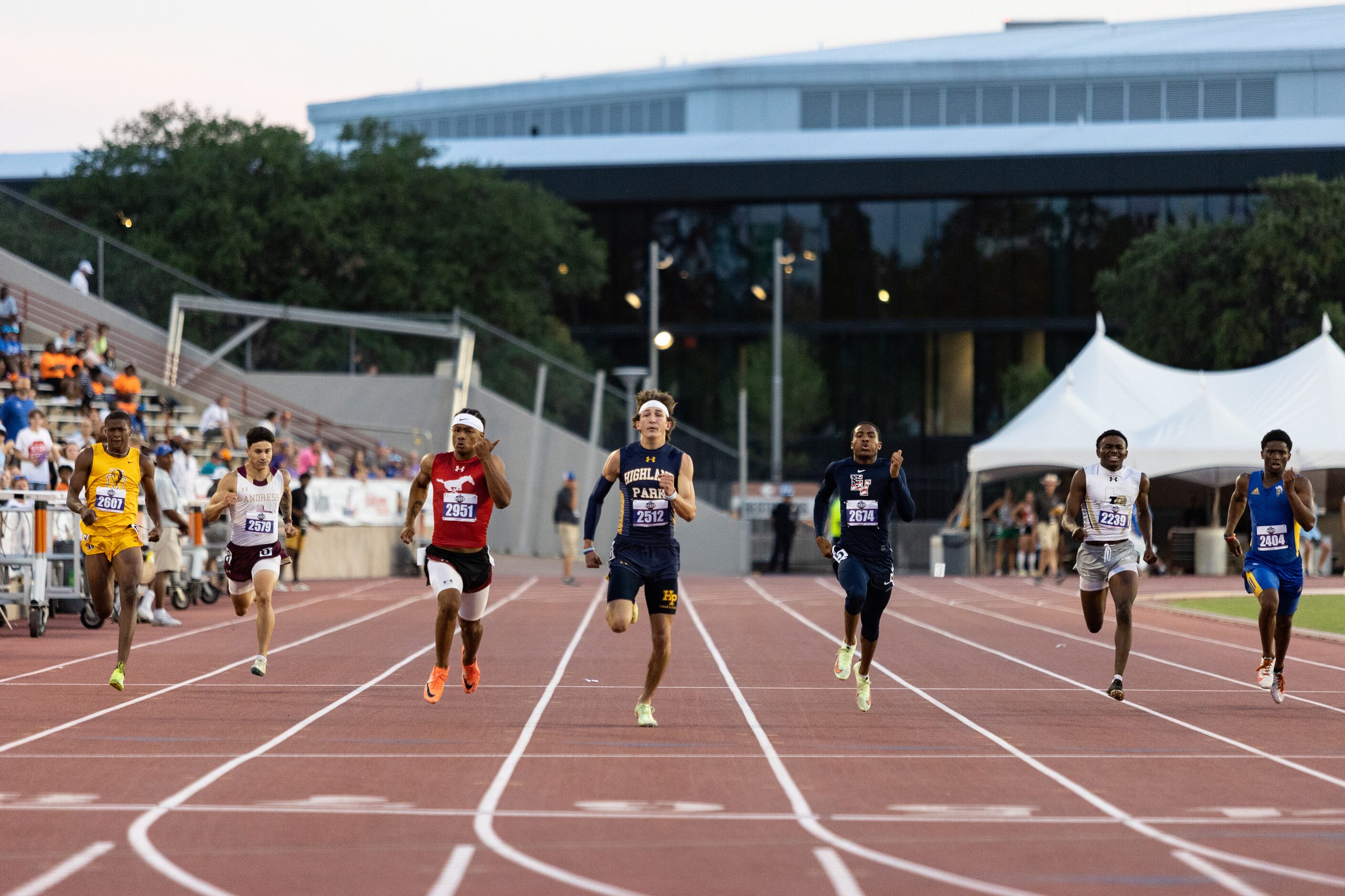 John Rutledge of Dallas Highland Park runs to the finish line during the boys’ 200m dash at...