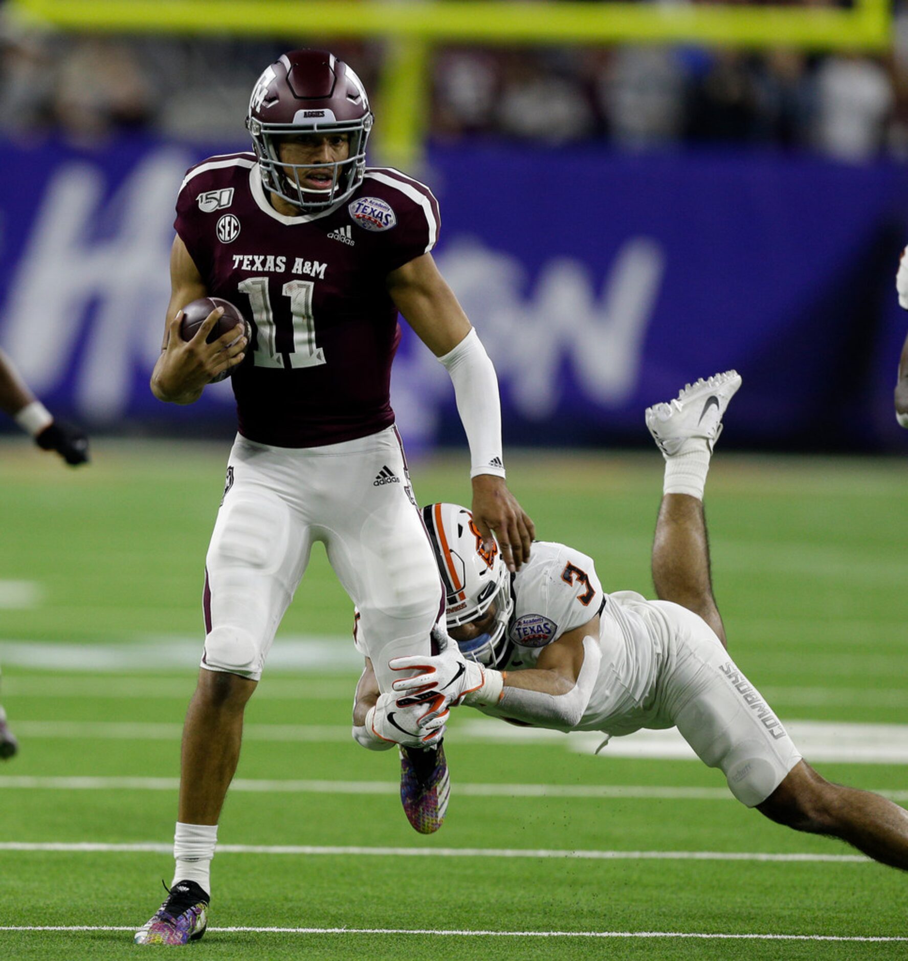 HOUSTON, TEXAS - DECEMBER 27: Kellen Mond #11 of the Texas A&M Aggies runs for 66 yards as...