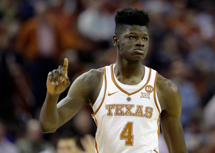 FILE - In this Feb. 7, 2018, file photo, Texas forward Mohamed Bamba (4) gestures during the...