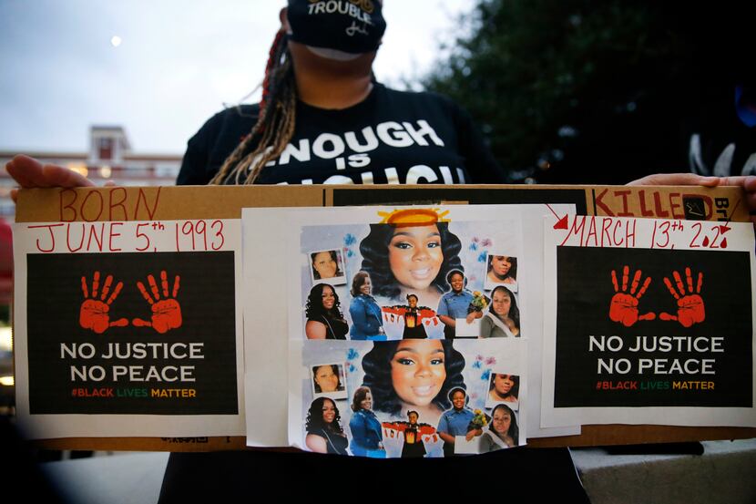 Shena Lee of Dallas displayed photos of Breonna Taylor during a Next Generation Action...