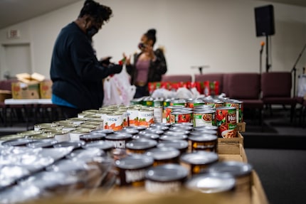 Ms. Paula Johnson  (left) and April Parker (right) seen here working on food distribution...