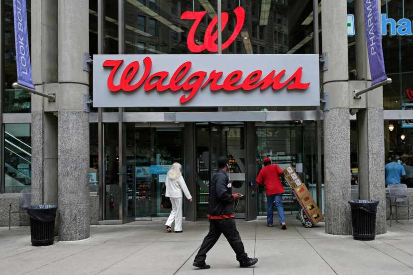 This June 4, 2014 photo shows a Walgreens retail store in Boston. Walgreen Co. _ which bills...