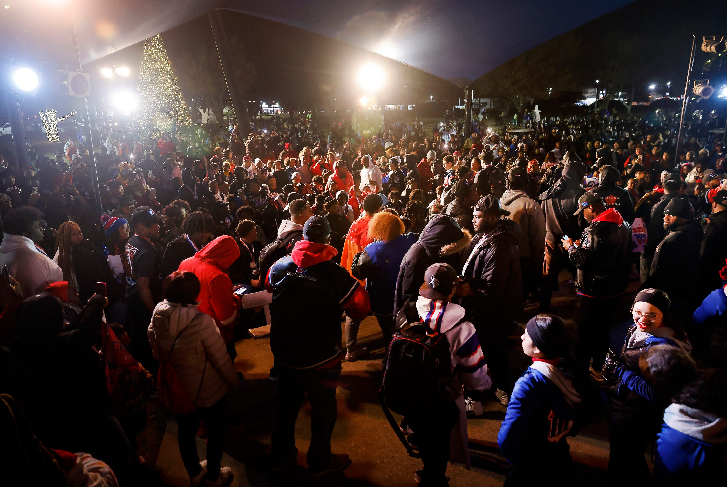 Football players, students and parents gathered in Armstrong Park to celebrate the...