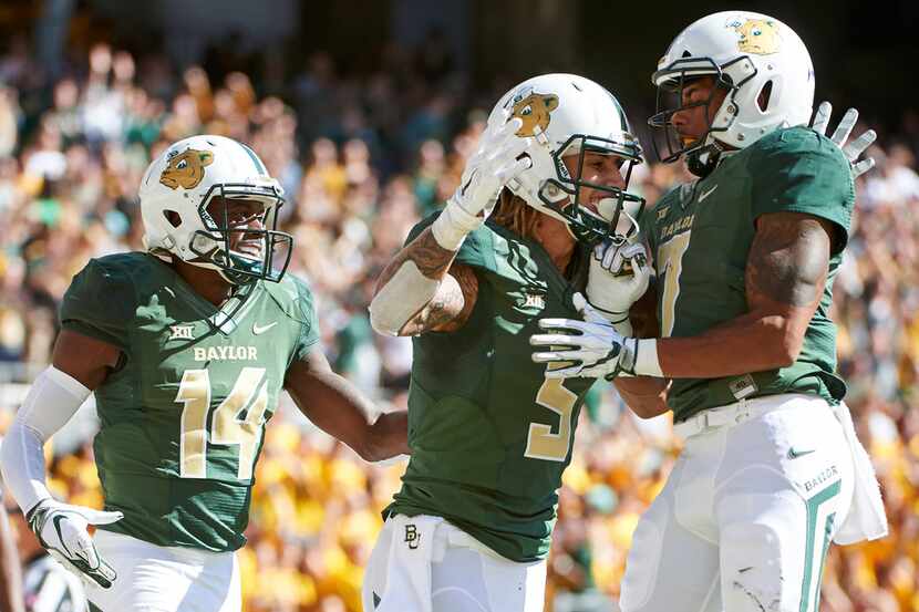 WACO, TX - NOVEMBER 3:  Jalen Hurd #5 of the Baylor Bears celebrates with teammates after...
