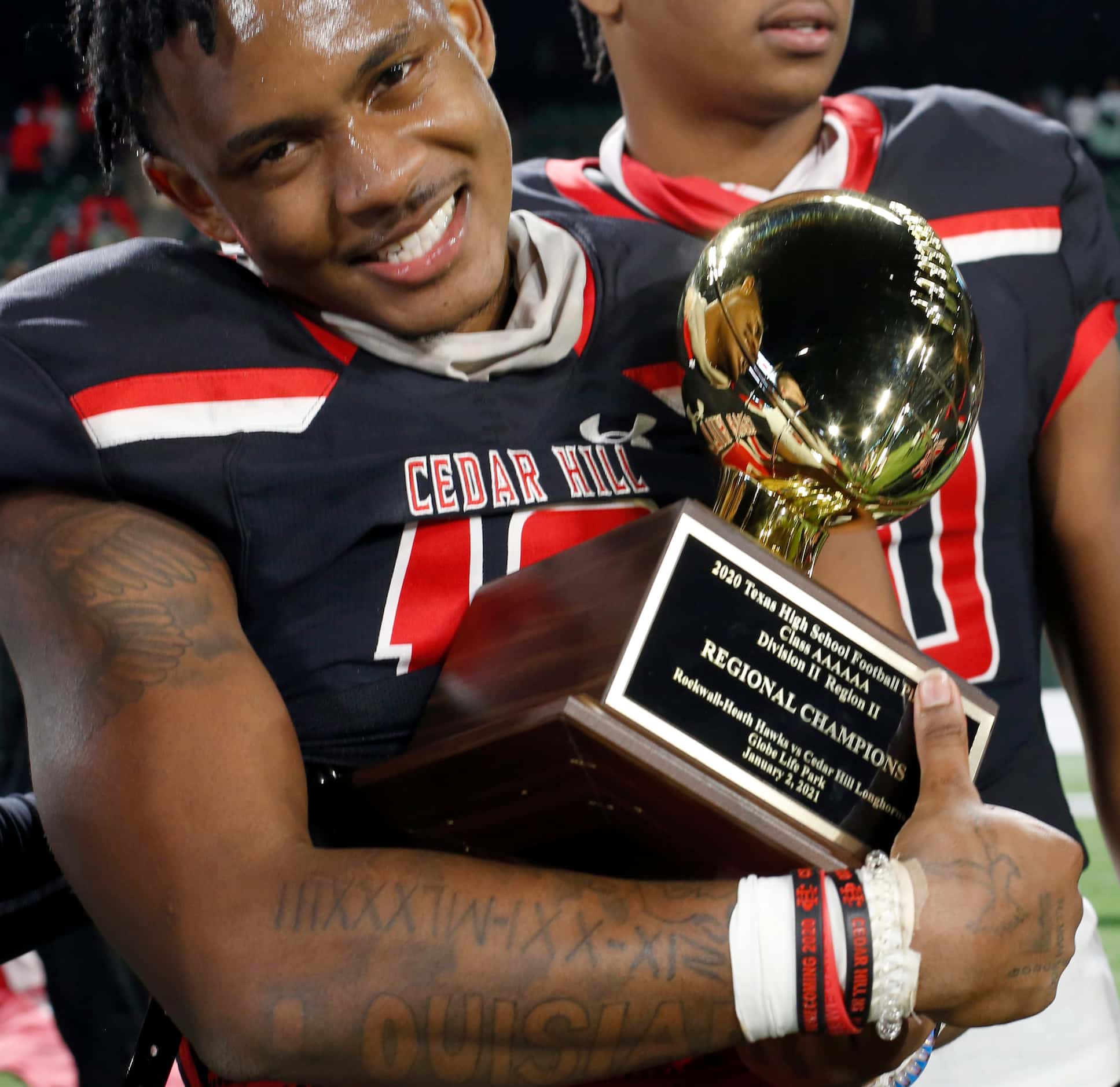 Cedar Hill receiver Earnie Moore (10) flashes a smile as big as the Longhorns 27-24 victory...